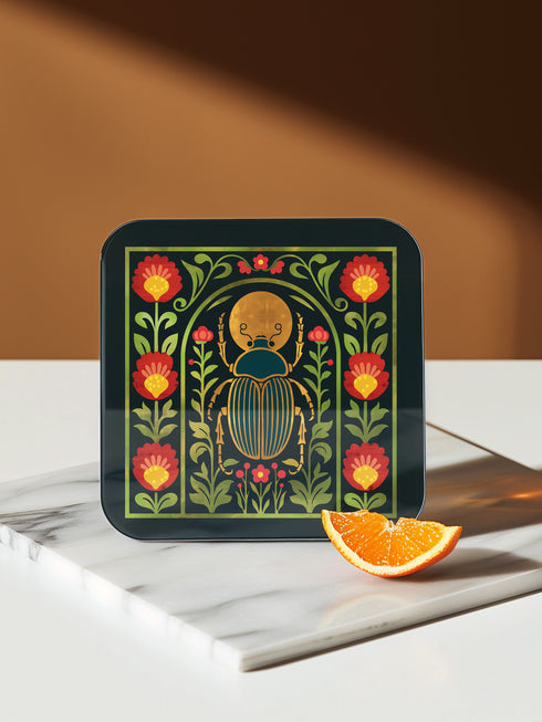 Set of 4 square Dark Academia Scarab Beetle Coasters, featuring detailed Gothic Botanical insect art prints in deep jewel tones. The hardboard coasters have a glossy finish and protective cork base. Premium Entomology Decor.